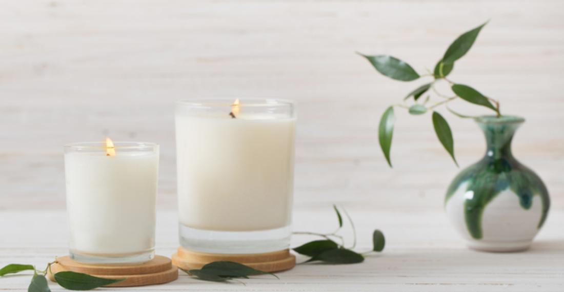 Two candles and a vase.